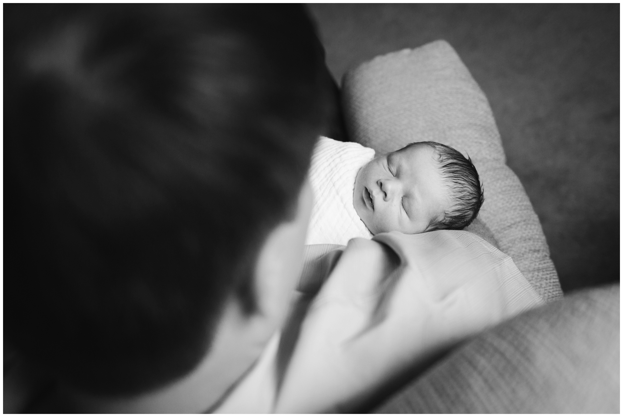 Chatham-kent newborn photographer, newborn photographer in chatham kent, overhead image of baby in fathers arms
