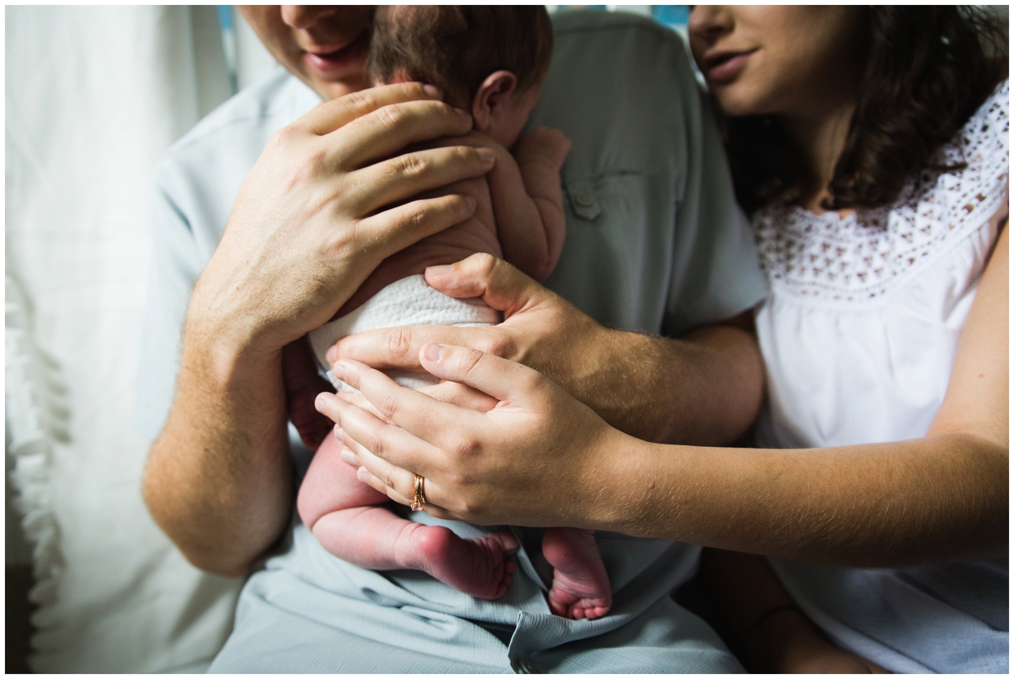 Chatham-kent newborn photographer, newborn photographer in chatham kent,brittany vanruymbeke, parents hands on newborn baby