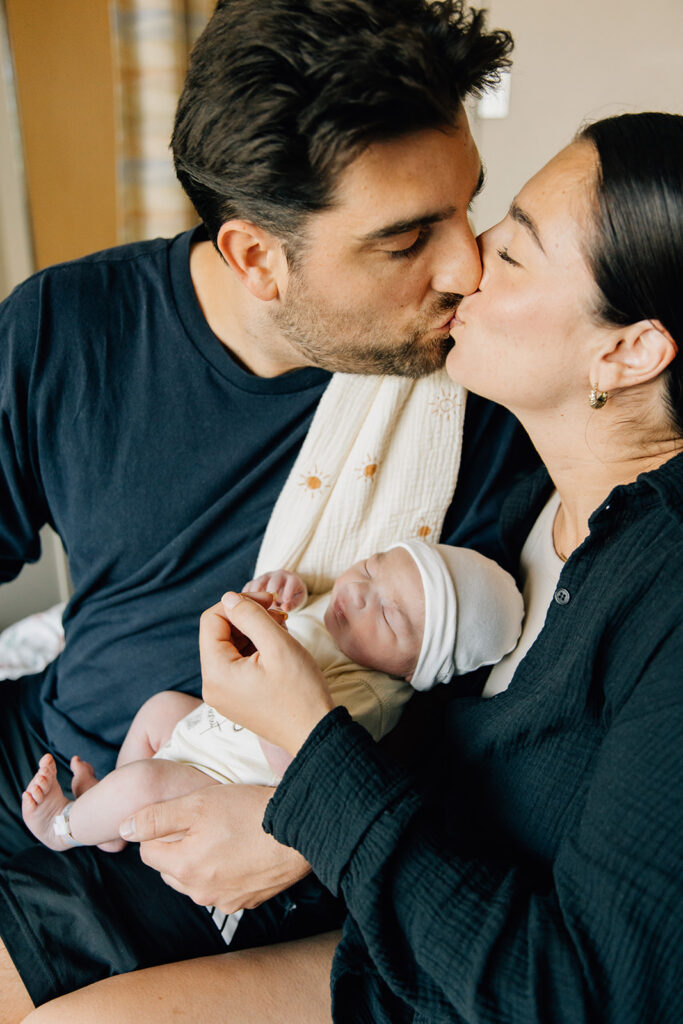 "Parent holding newborn skin-to-skin, Fresh 48 in-hospital session, Sarnia-Lambton Ontario photographer Brittany VanRuymbeke"