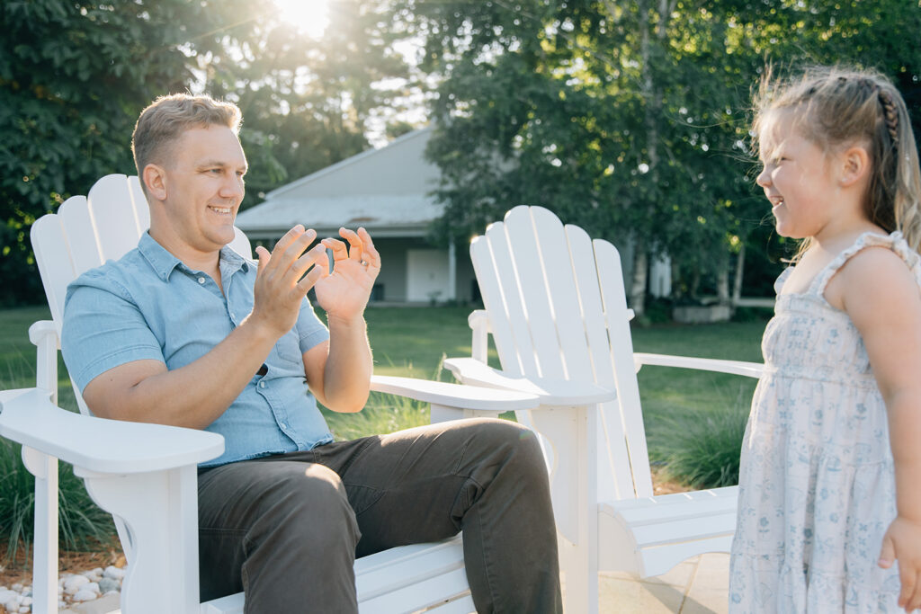 Chatham-Kent Family Photographer Family playing together during relaxed outdoor photo session near Sarnia Ontario